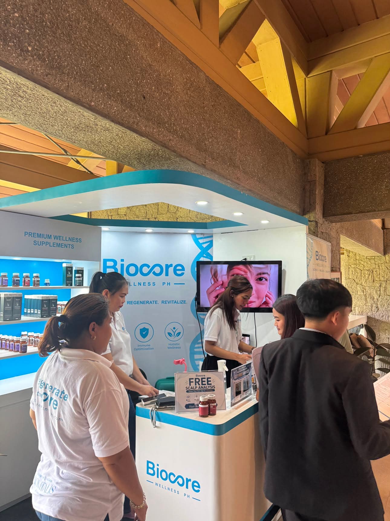 Biocore Wellness team assisting attendees at event booth